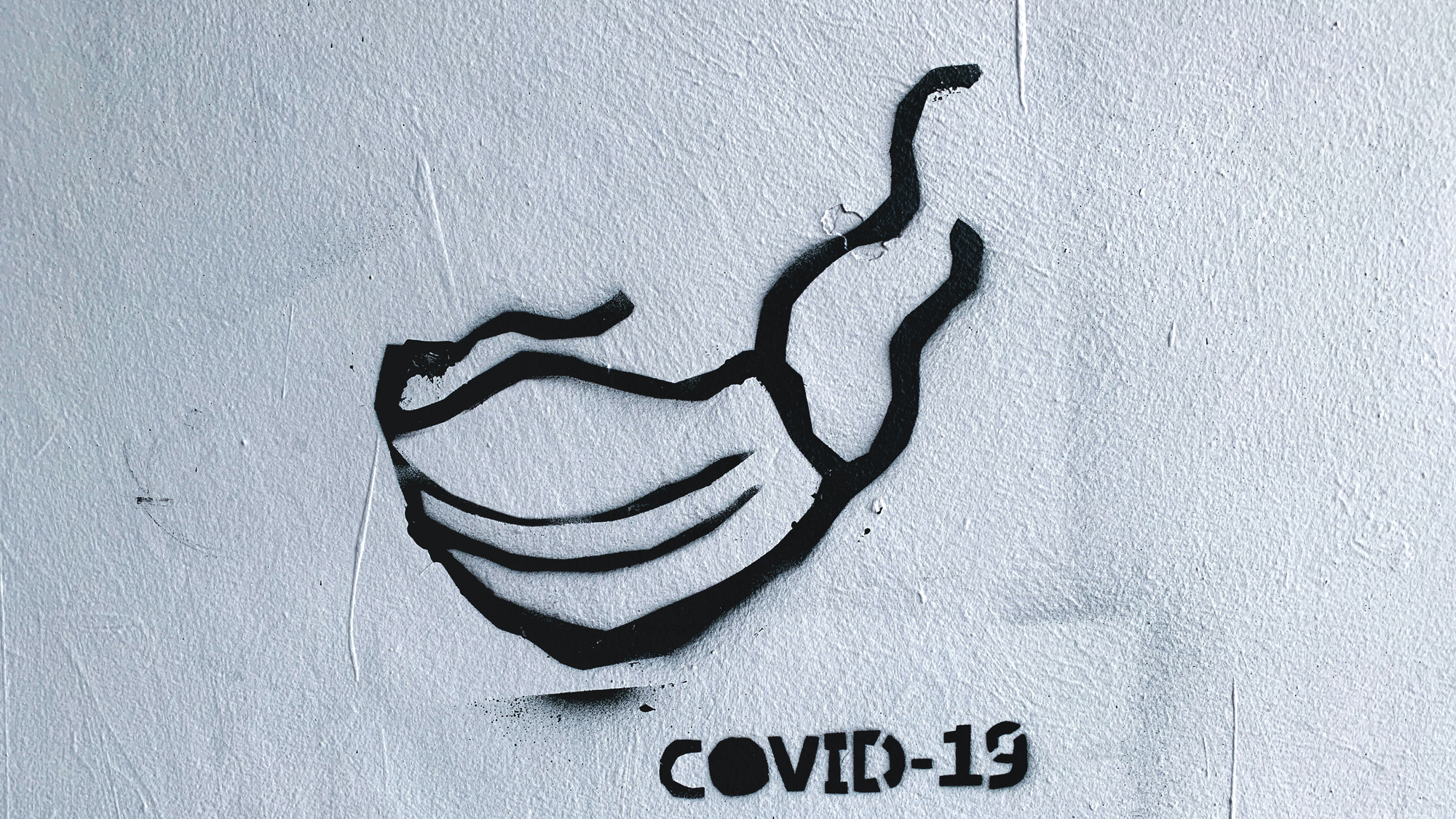 Graffiti einer Covid-Maske.