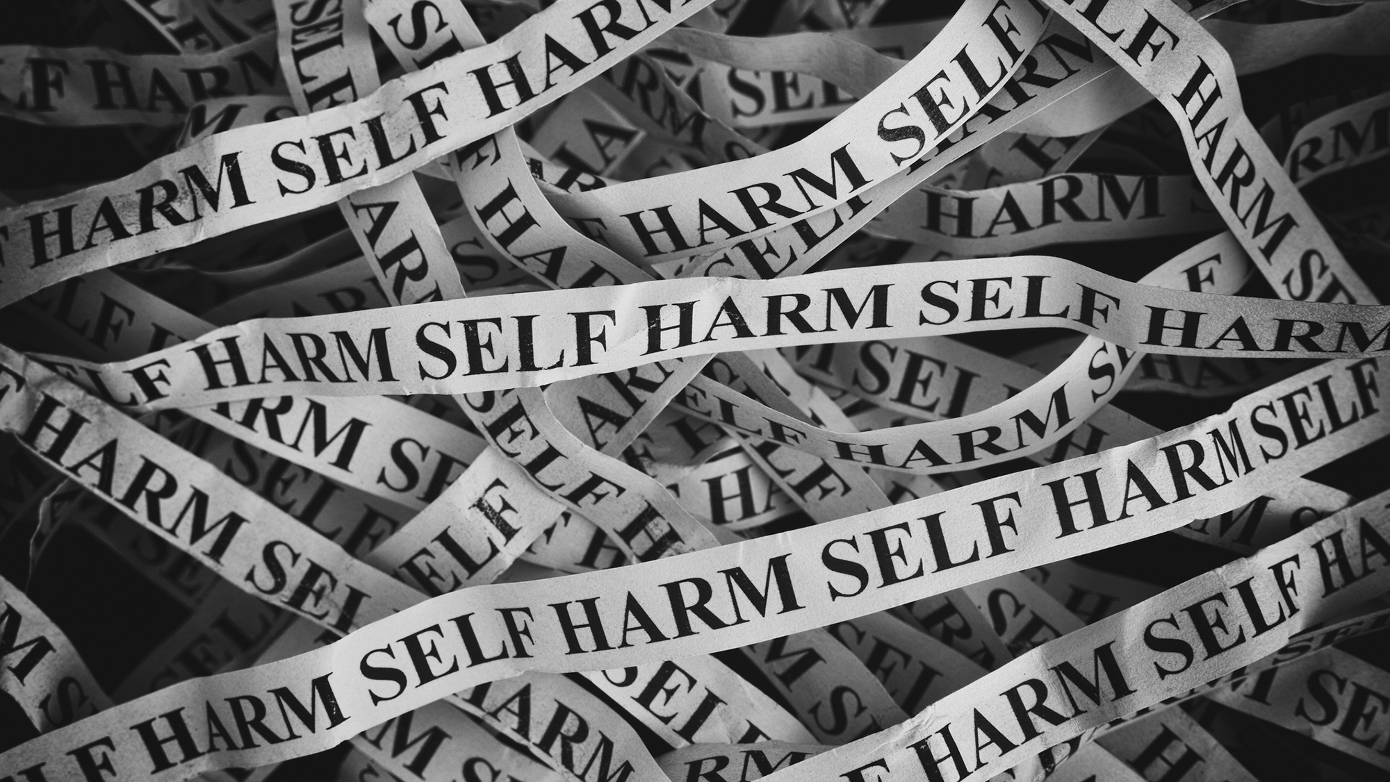 Bänder mit Aufschrift "self harm"